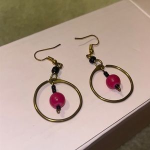 Handmade gold hoop earrings with black and purple beads